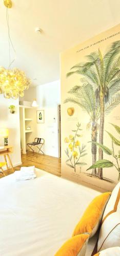 a bedroom with a palm tree mural on the wall at Napoli Tree - Lungomare in Naples