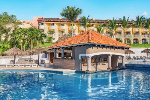 a resort with a swimming pool with a gazebo at Grand Palladium Vallarta Resort & Spa - All Inclusive in Punta Mita