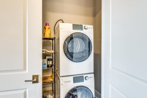 a washer and dryer sitting in a room at Community Perks Mountain-View Condo in Toccoa! in Toccoa