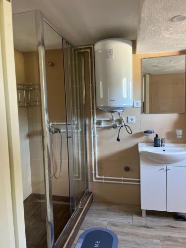 a bathroom with a shower and a sink at Durmitor Stay in Žabljak