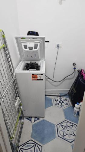 a small refrigerator freezer sitting in a room at Il filo di Arianna Ischia Sapri in Sapri
