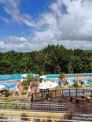 a view of the pool at a resort at Apartamento Inteiro Mobiliado in Parnamirim