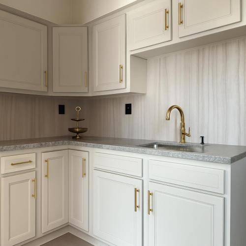 a kitchen with white cabinets and a sink at 2 Beds Free parking City Escape in Pittsburgh
