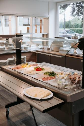 a kitchen with many different types of food on a counter at Europa-Haus-Bocholt - Bett & Bike in Bocholt