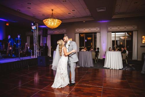 a bride and groom dancing on the dance floor at their wedding at DoubleTree by Hilton New Orleans in New Orleans