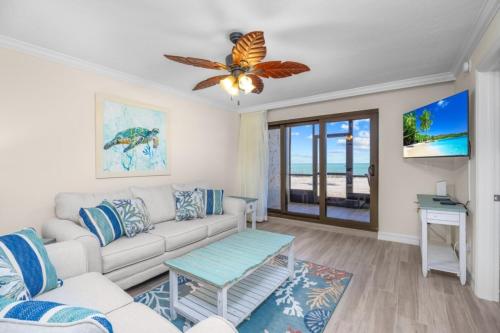 a living room with a couch and a table at Pointe Santo E4 condo in Sanibel