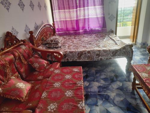 a living room with a couch and a table at Hill View Tower, Sylhet, Shah Poran, Sylhet in Debpur