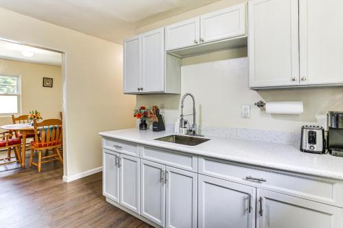 a kitchen with white cabinets and a sink at 2 Mi to The Marketplace Spring Valley Apartment in Spring Valley
