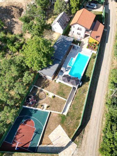 an overhead view of a house with a swimming pool at Kosmajko in Koraćica
