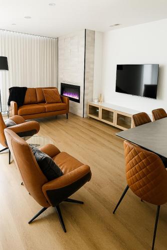 a living room with a couch and a table at Modern Minimalist Apartment in Belconnen