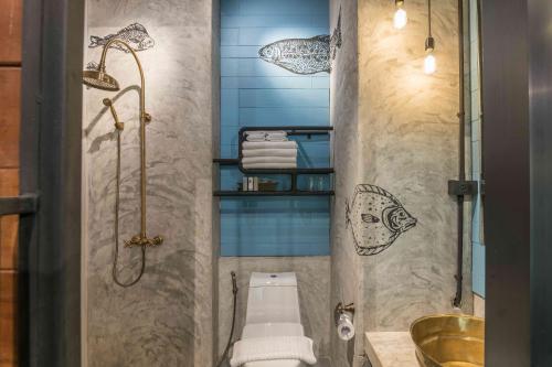 a bathroom with a toilet and a shower at Sea Crest by Jomtien in Jomtien Beach