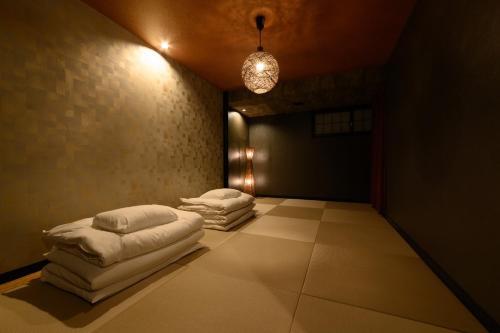 a room with three pillows on the floor at Sakurabashi - Vacation STAY 91888v in Kanazawa