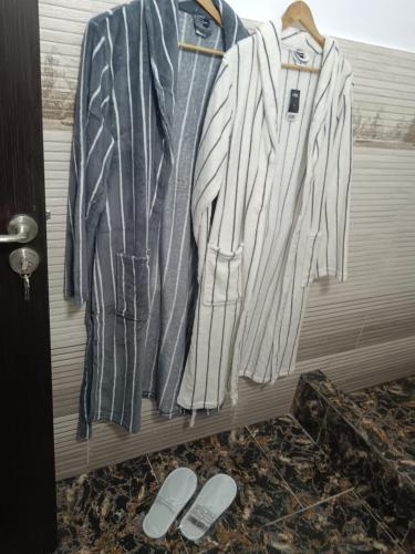 a group of clothes hanging on a rack at Seven Studio in Saturn