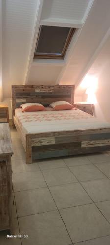 a large bed in a room with a ceiling at Résidence Belle Vue des îles in Sainte-Anne