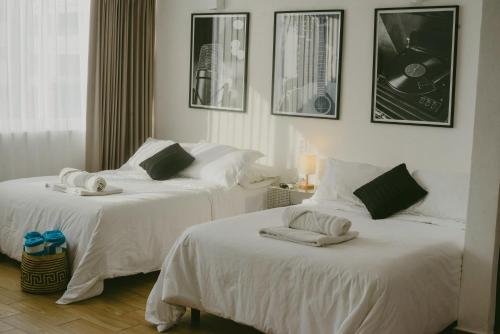 two beds in a hotel room with towels on them at BeachView & Balcony 3905 in Cancún
