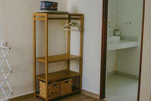 a wooden shelf in a bathroom with a mirror at BeachView & Balcony 3905 in Cancún