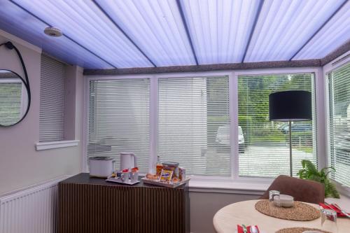 Et tv og/eller underholdning på Luss Cottages at Glenview