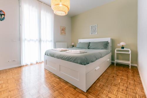 Ένα ή περισσότερα κρεβάτια σε δωμάτιο στο Como Lake - Modern Apartment