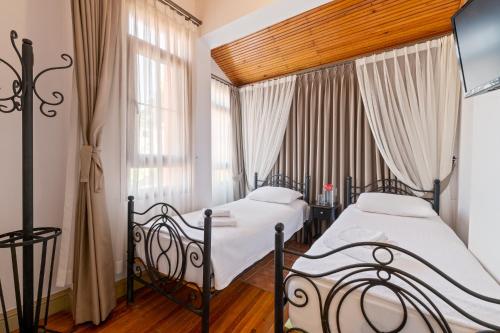 Ένα ή περισσότερα κρεβάτια σε δωμάτιο στο Han Urla Otel
