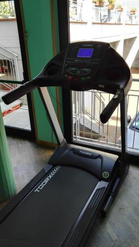 a close up of a treadmill in front of a door at Hotel Astoria in Tabiano
