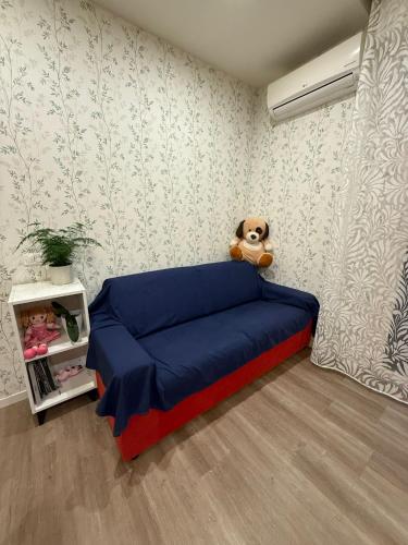 a bedroom with a blue bed with a teddy bear at da angela in Montelabbate