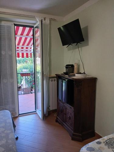 a television on top of a dresser in a room at Imperiale in Sarzana