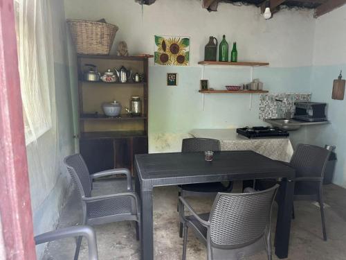 a dining room with a table and chairs at OK Sakhli VIP in Shekvetili