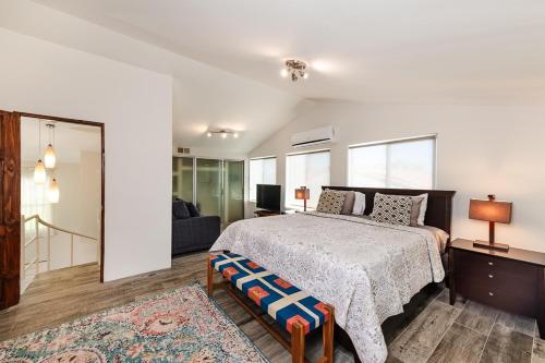 a bedroom with a large bed and a couch at Beautiful 3 Bedroom Condo With Ocean Views in Tamarindo
