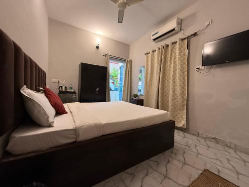 Televisyen dan/atau pusat hiburan di Casa Almeida by Legends Hotels