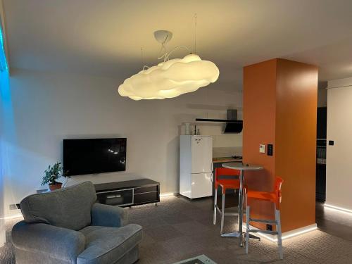 a living room with a couch and a table at Apartament Baszta 7 Płaszczy, Panieńska in Szczecin
