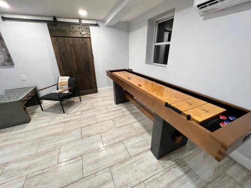 a ping pong table in a room at Cozy Cabin On the Lake with HotTub in Hopatcong