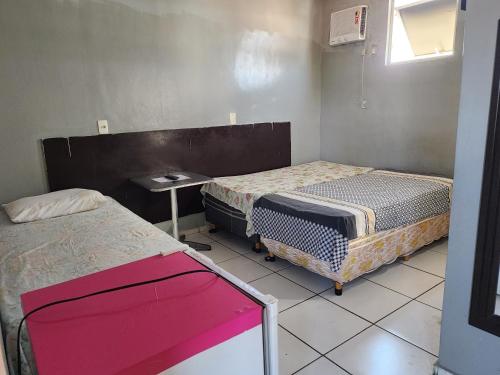Postel nebo postele na pokoji v ubytování Condomínio Center luz