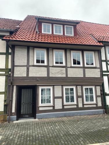 a large house with a red roof at Gästezimmer alte Schneiderei in Duderstadt