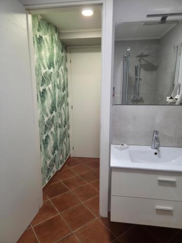 a bathroom with a sink and a mirror at Cà Fiamma 3 in Casale Monferrato