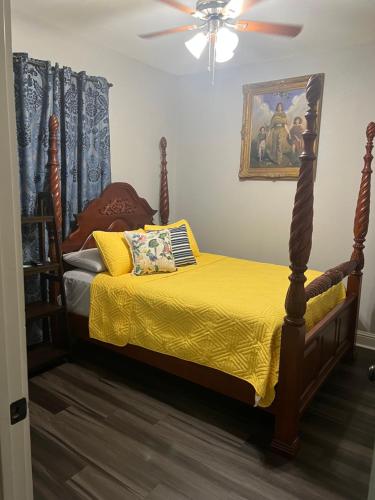 a bedroom with a bed and a ceiling fan at Morning Glory in Longview