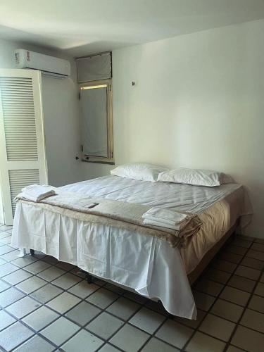 a bedroom with a large bed in a room at Pousada Cajueiro Beach House in Parnaíba