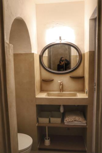 a bathroom with a sink and a mirror at Lake View and Sheltered Terrace in Bauduen