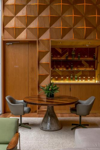 a dining room with a table and chairs at Emiliano Rio in Rio de Janeiro