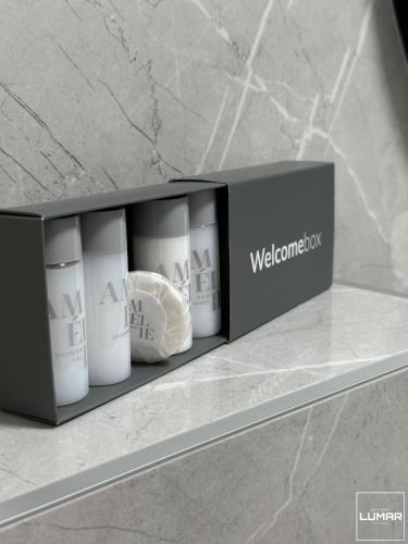 a black box with three white cups on a counter at Apartment Lumar in Ljubuški