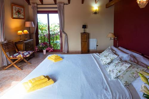 a bedroom with a large white bed with pillows at VILLA NABRISA MARBELLA, 5 BEDROOM, PRIVATE POOL, GARDEN, BBQ in Marbella