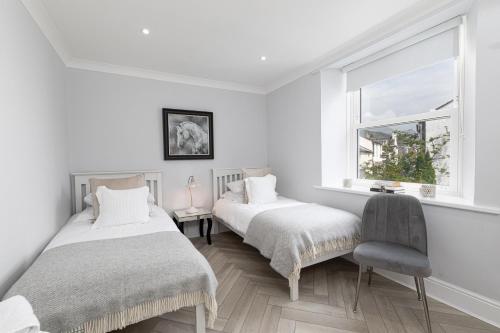 Ένα ή περισσότερα κρεβάτια σε δωμάτιο στο Stunning 2 bedroom Apartment in Central Keswick