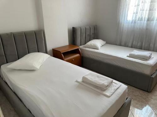En eller flere senge i et værelse på Prima apartment