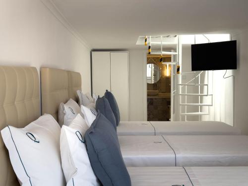 TV o dispositivi per l'intrattenimento presso Queen's Ocean Sight - Guest House
