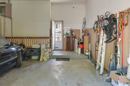 a room with a garage with a car in it at 6 Shared Acres, Pool Table Barrington Hills Apt! in Barrington
