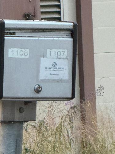 a mail box on the side of a building at Kraatterin Helmi Suite in Lappajärvi