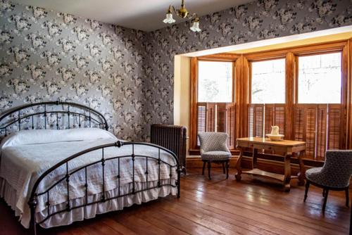 Ένα ή περισσότερα κρεβάτια σε δωμάτιο στο Hotel Manning