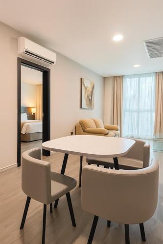 a living room with a table and chairs at Tryp by Wyndham Panama Centro in Panama City