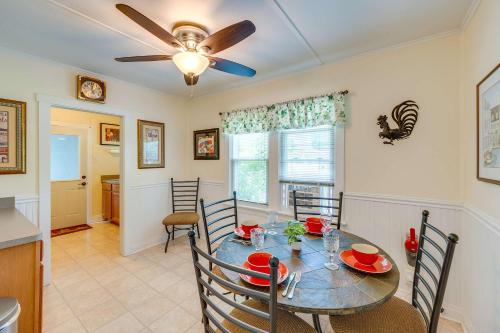 a dining room with a table and a ceiling fan at Como Cottage - Stay for 6 in Lake Geneva