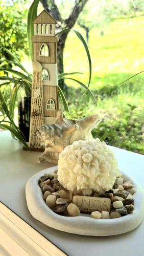 a plate of food with a building on a table at Villa del Poggio in Poggio Mirteto