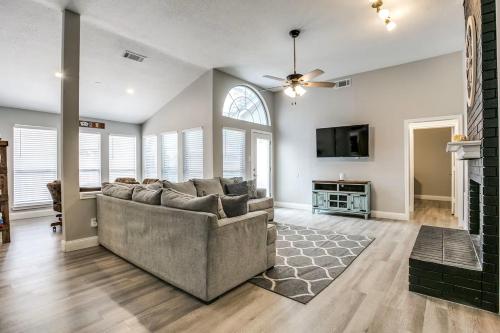 a living room with a couch and a fireplace at Family-Friendly Fun, Pool, Game Room, DFW Airport in Lewisville